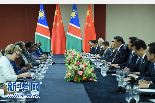 12月4日，國家主席習近平在約翰內斯堡會見納米比亞總統(tǒng)根哥布。 新華社記者 張鐸 攝